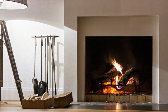 Gas fireplace burning cleanly in a white Redondo Beach living room